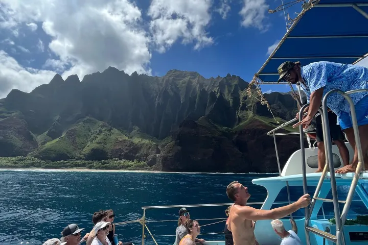 a group of people in a boat on a body of water